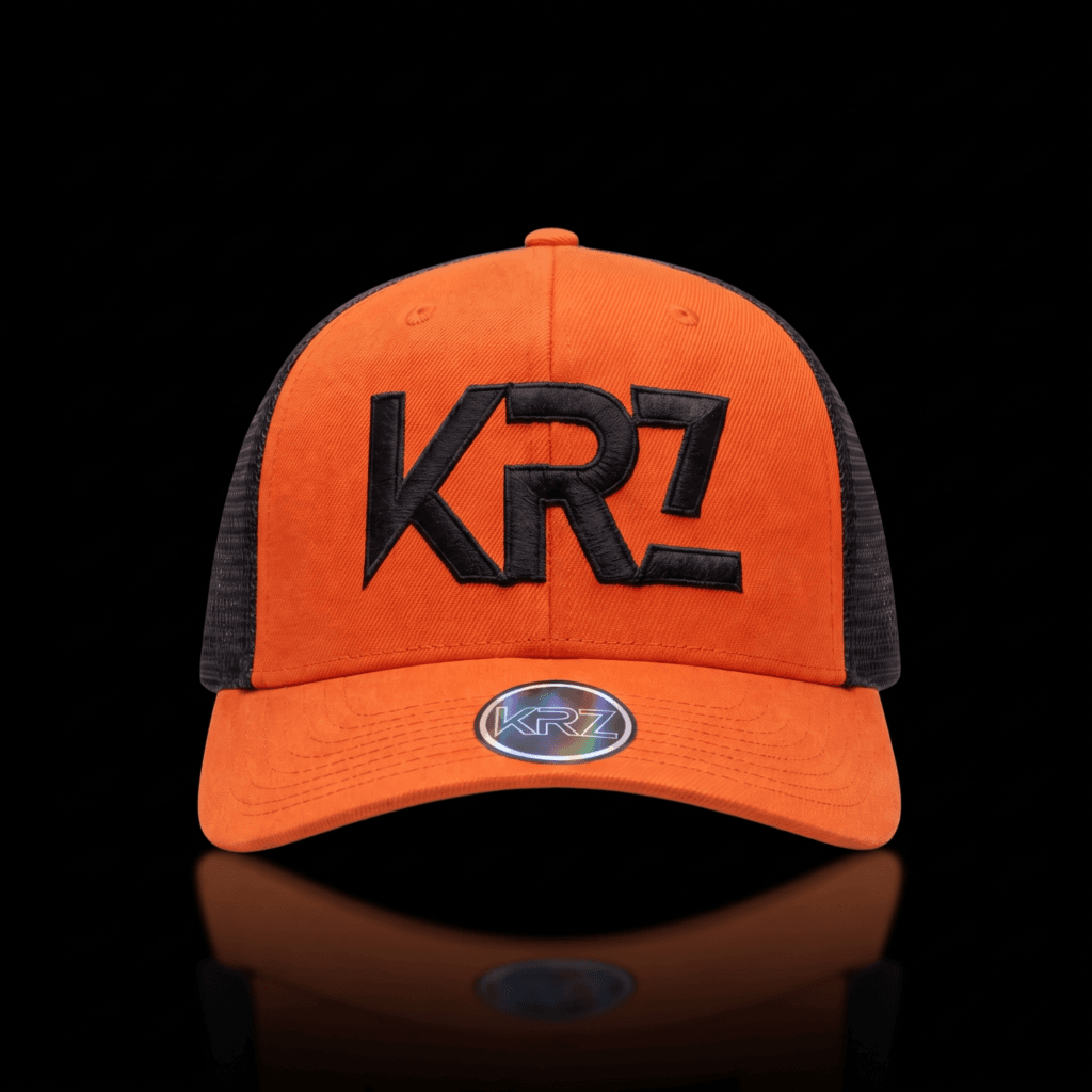 KRZ Navy Blue Trucker Cap featuring a structured navy blue front, matching navy mesh back, curved navy peak and premium white outline embroidered KRZ logo. Finished with the signature KRZ brim badge and presented as part of the KRZ Official premium streetwear collection.